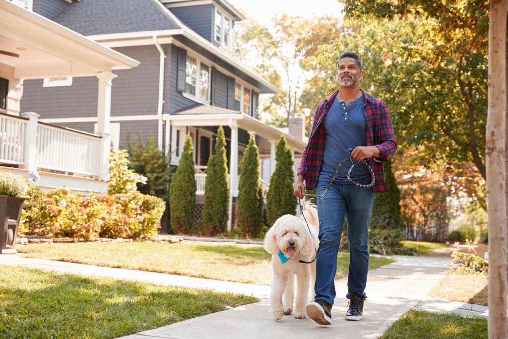 man walking his dog outside two steps quiet sniff barking pee cue wait house dog's start walking retractable leash