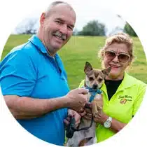 Image of Tim and Maria, owners of Scoop Masters pet waste removal service in Los Angles, and Sparky the dog