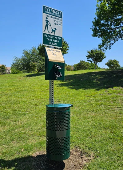 image of dogipot pet waste station on scoop masters austin texas pet waste removal page.
