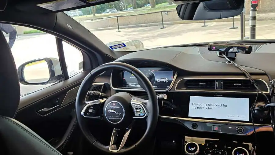 Image of the inside of a waymo self driving vehicle for scoop masters pet waste removal blog.