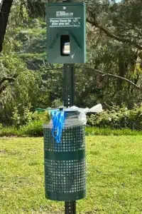 Image of a pet waste station that is not maintained properly showing why an HOA could use a service like Scoop Masters