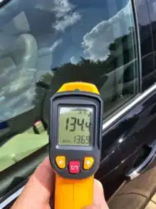 Image of temperature of inside a car at 90 degrees cloudy day.
