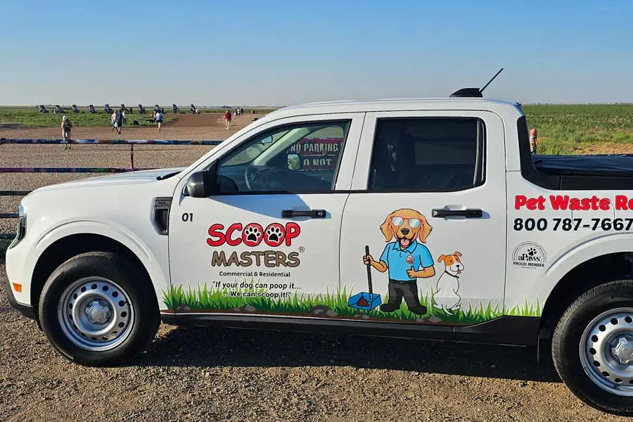 image of Scoop Masters pet waste removal truck in front of Cadillac Ranch entrance