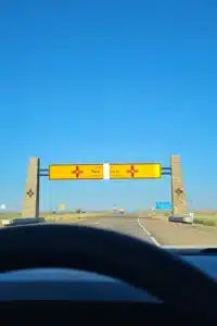 image of scoop masters pet waste removal service showing entering New Mexico sign.